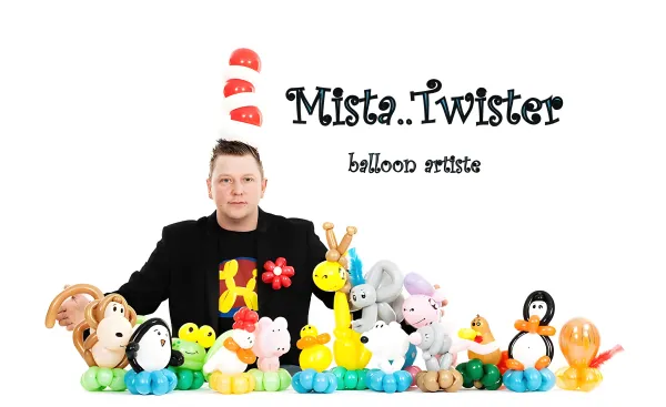 Mista Twister wearing a balloon hat with a large display of balloon animals